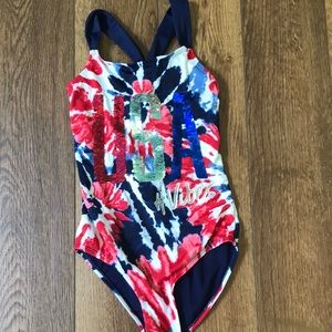 A red,white,and blue flip sequin Justice one piece swimsuit